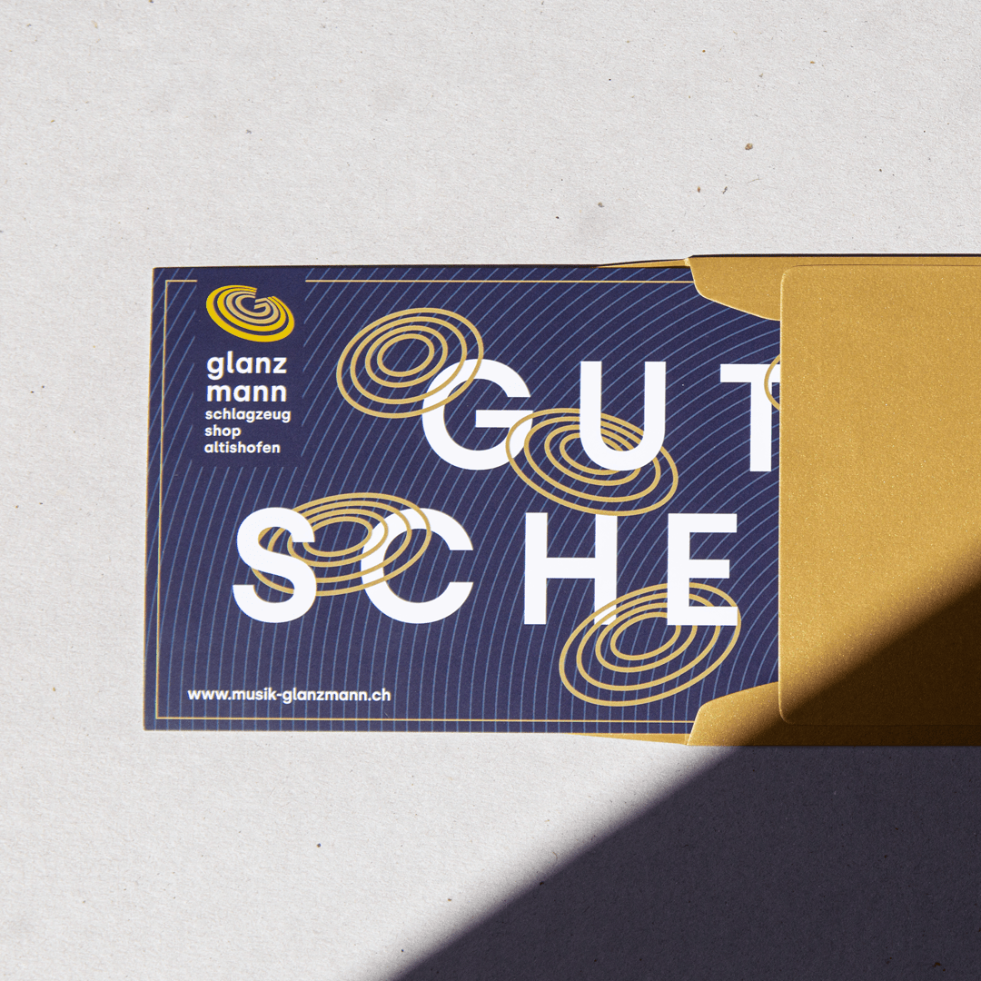 Gutschein von Schlagzeugshop Glanzmann in goldenem Kuvert